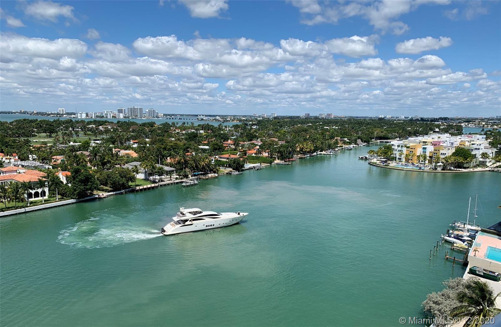 5750 Collins Avenue, Unit 15F Miami Beach, FL 33140 - Photo 1 of 65 an aerial view of a house with a lake view