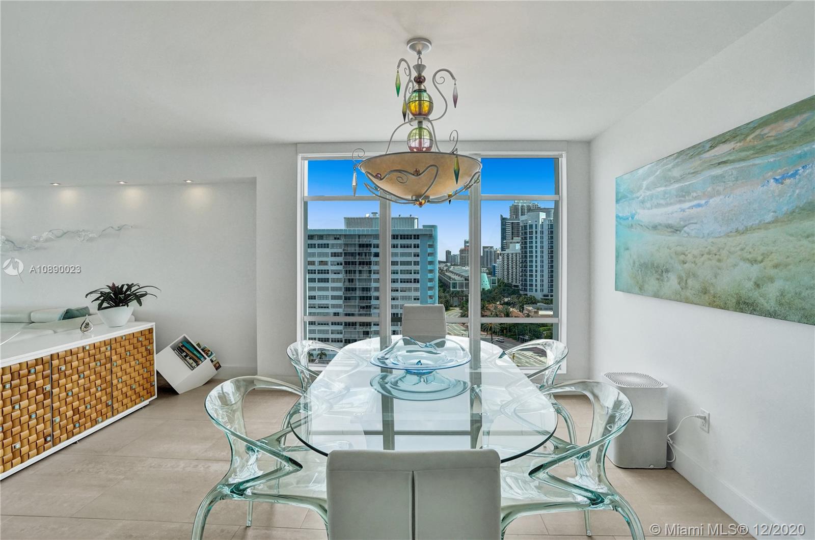 5750 Collins Avenue, Unit 15F Miami Beach, FL 33140 - Photo 11 of 65 a view of a dining room with furniture window and outside view