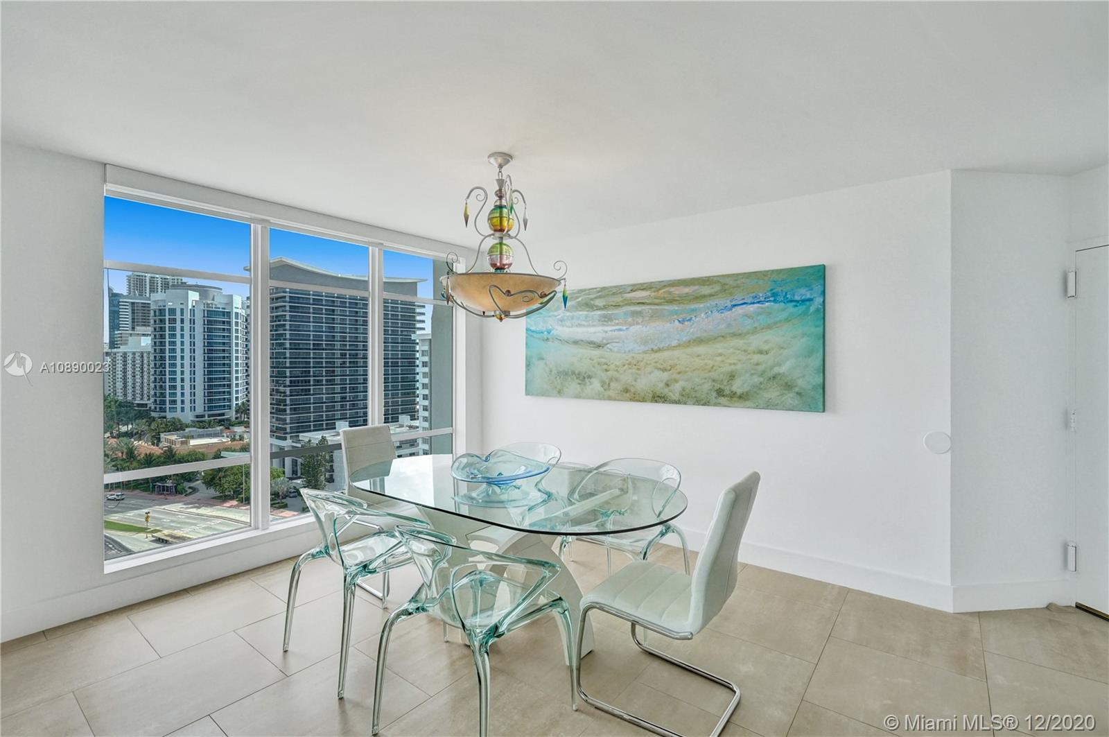 5750 Collins Avenue, Unit 15F Miami Beach, FL 33140 - Photo 12 of 65 a dining room with furniture and window