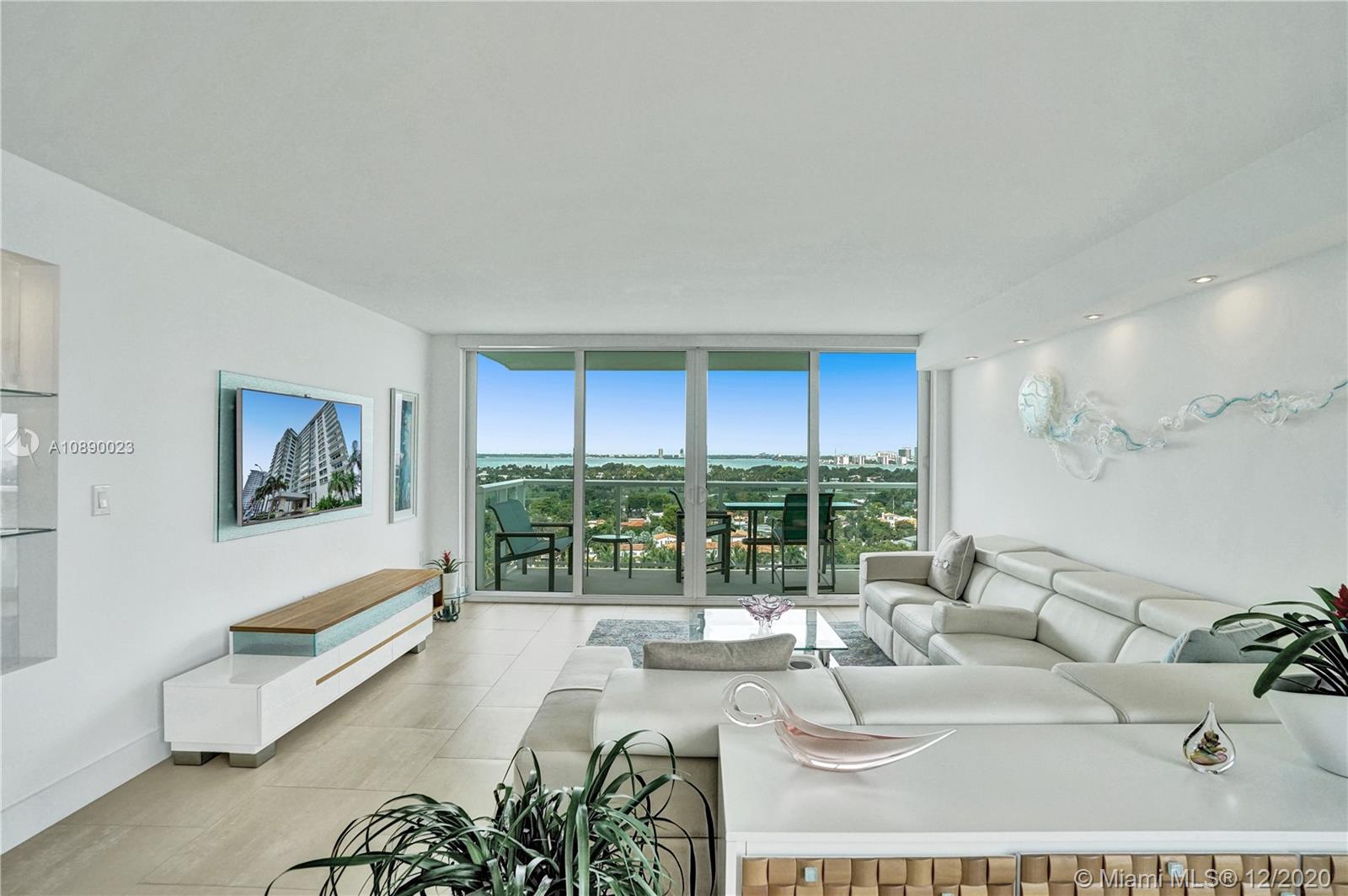 5750 Collins Avenue, Unit 15F Miami Beach, FL 33140 - Photo 4 of 65 a living room with furniture and a large window