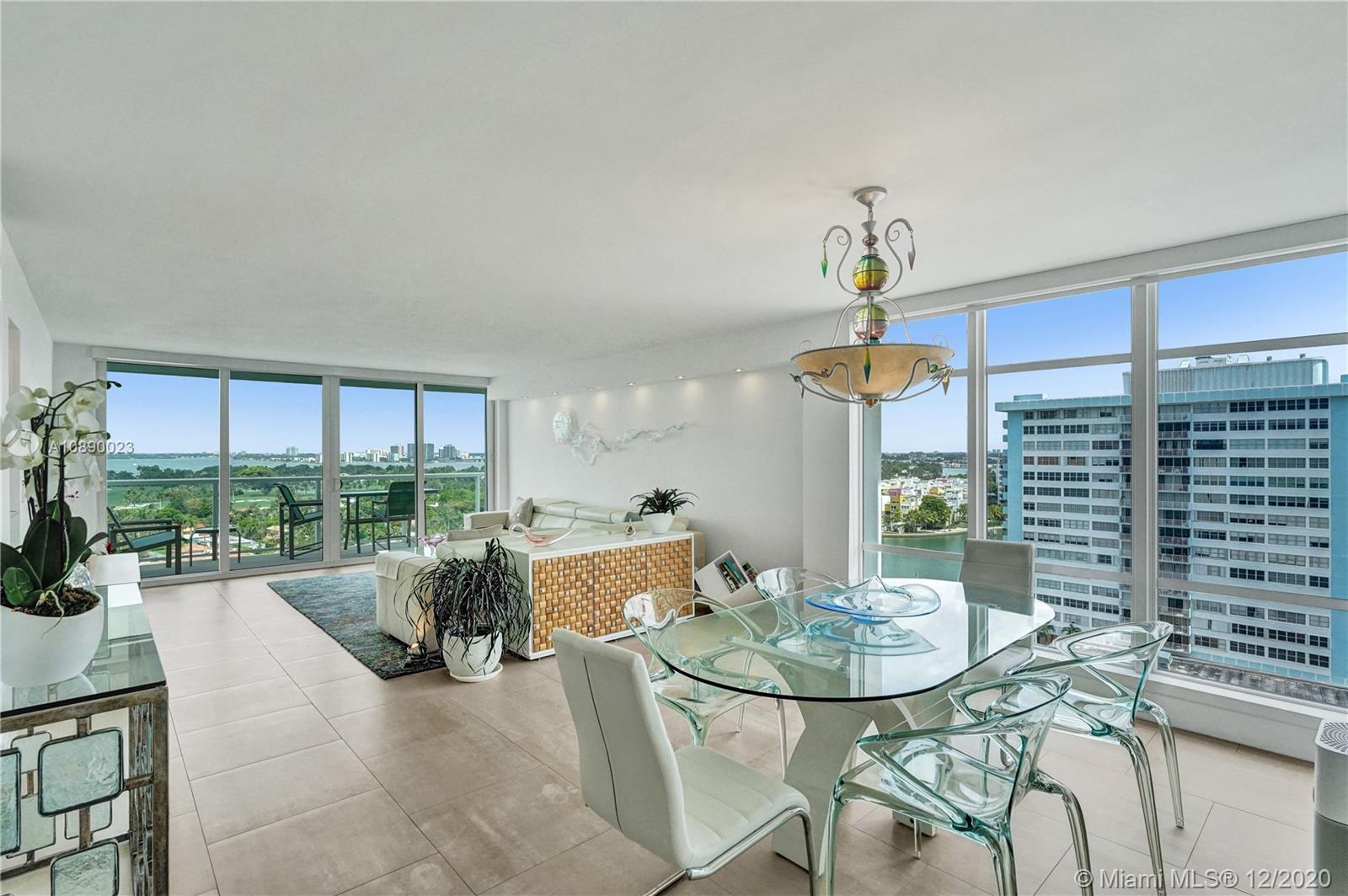 5750 Collins Avenue, Unit 15F Miami Beach, FL 33140 - Photo 5 of 65 a view of a dining room with furniture window and outside view