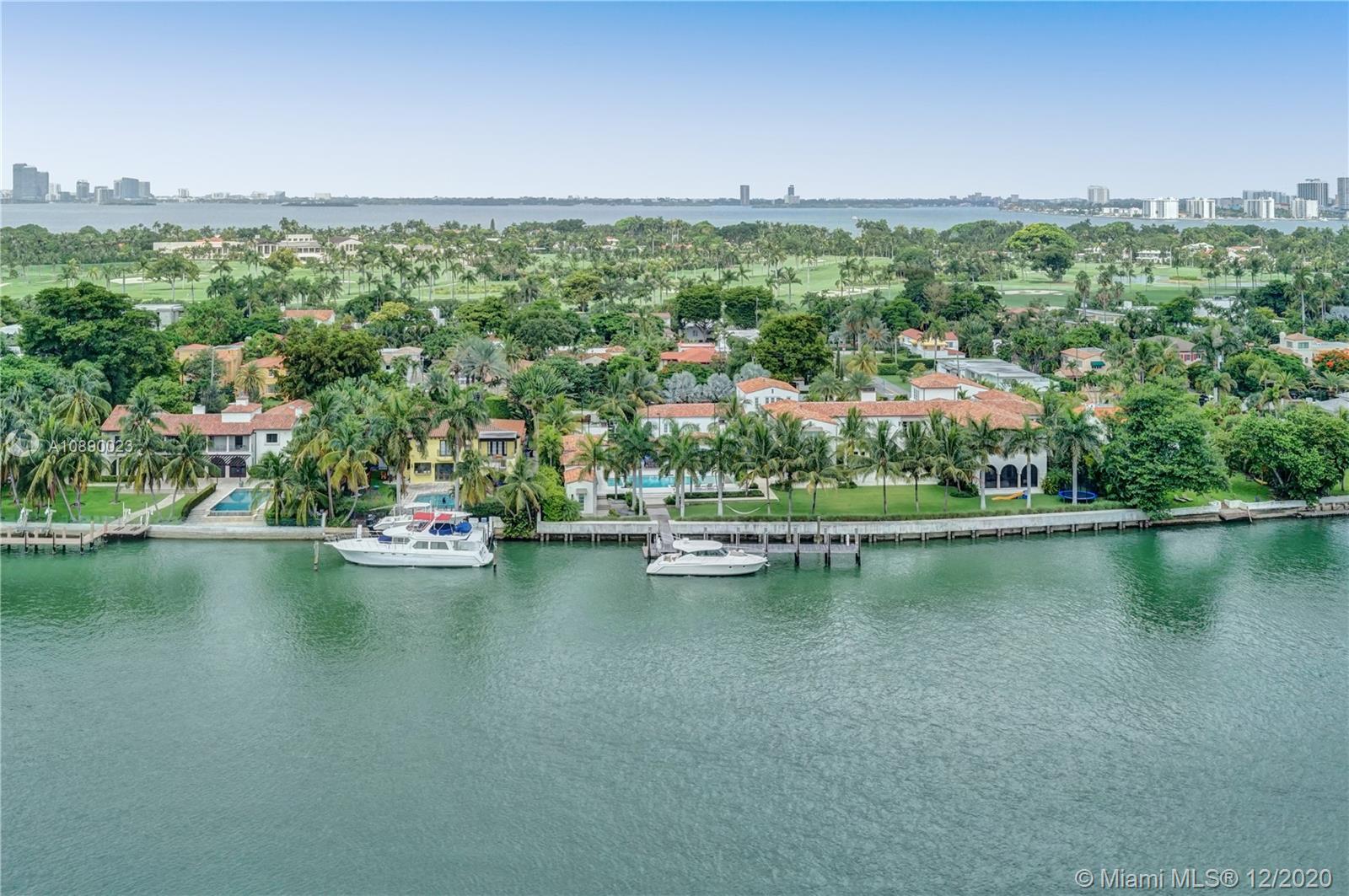 5750 Collins Avenue, Unit 15F Miami Beach, FL 33140 - Photo 50 of 65 an aerial view of residential houses with outdoor space and lake view