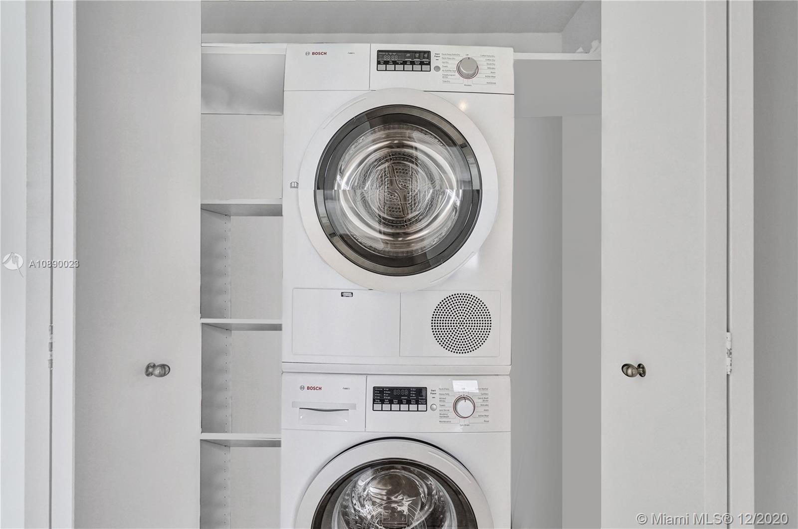 5750 Collins Avenue, Unit 15F Miami Beach, FL 33140 - Photo 53 of 65 a view of washer and dryer in a utility room