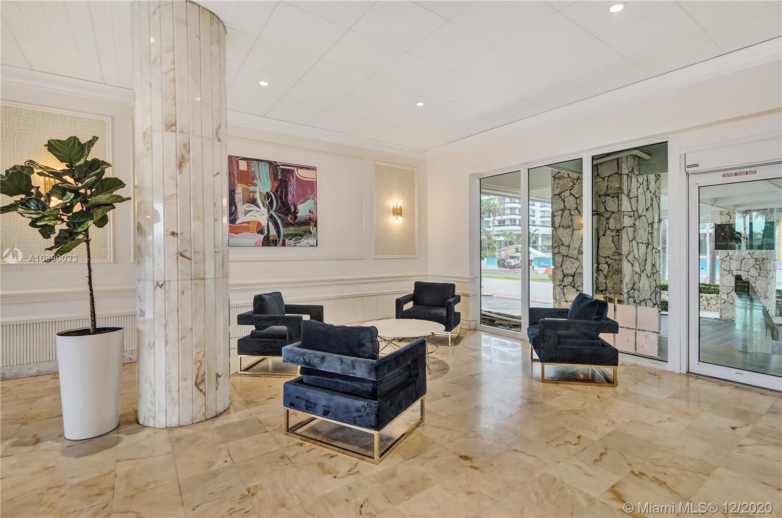5750 Collins Avenue, Unit 15F Miami Beach, FL 33140 - Photo 56 of 65 a living room with furniture and a potted plant