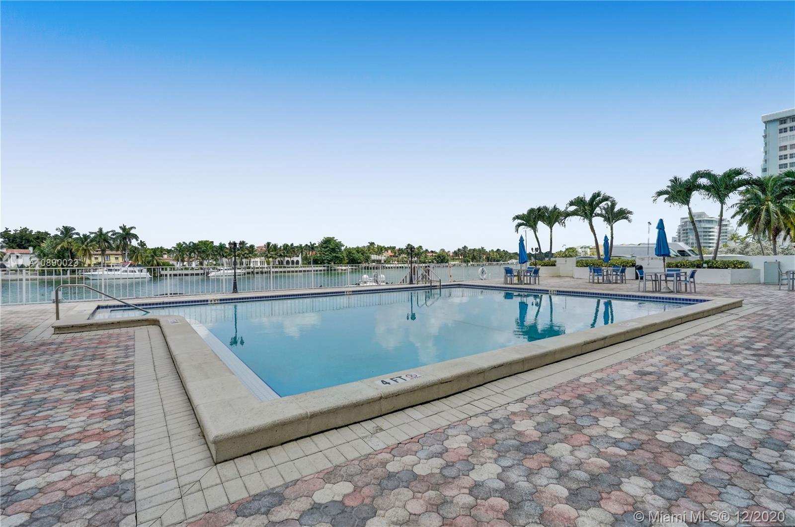 5750 Collins Avenue, Unit 15F Miami Beach, FL 33140 - Photo 58 of 65 a view of swimming pool with a lake view and mountain in the back