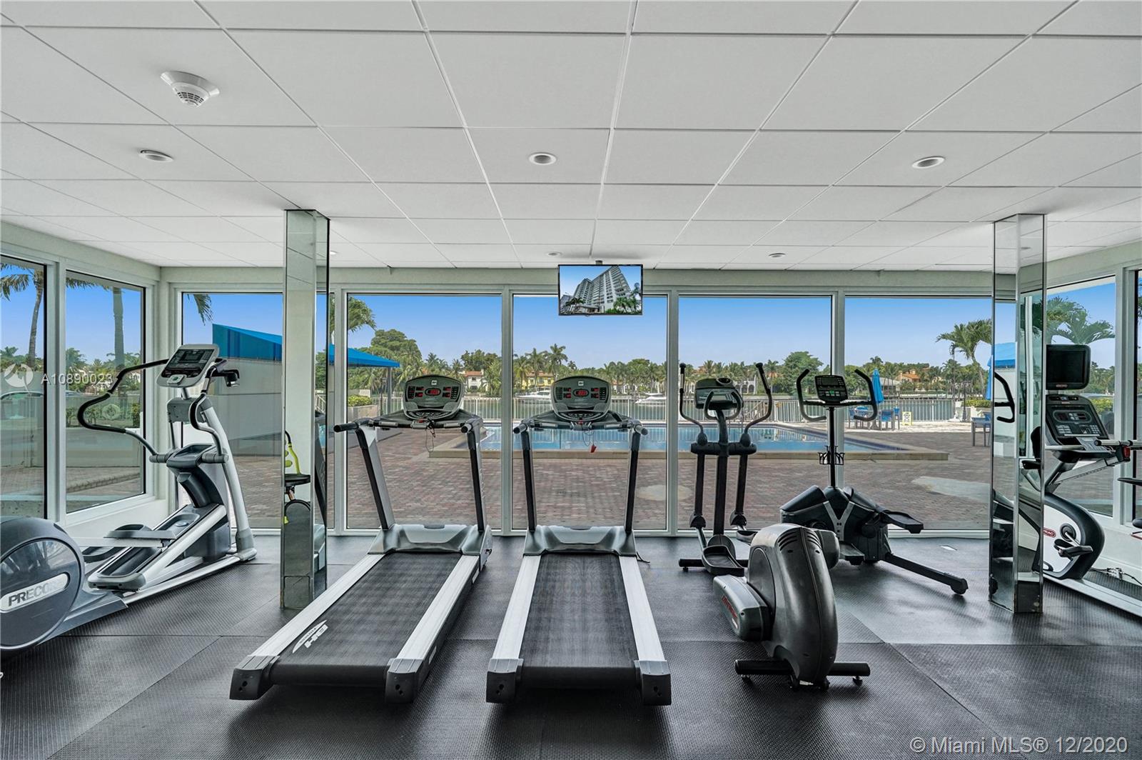 5750 Collins Avenue, Unit 15F Miami Beach, FL 33140 - Photo 61 of 65 a view of a room with gym equipment