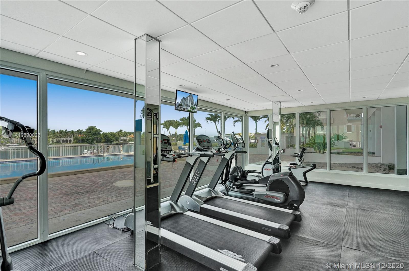 5750 Collins Avenue, Unit 15F Miami Beach, FL 33140 - Photo 63 of 65 a view of a room with gym equipment