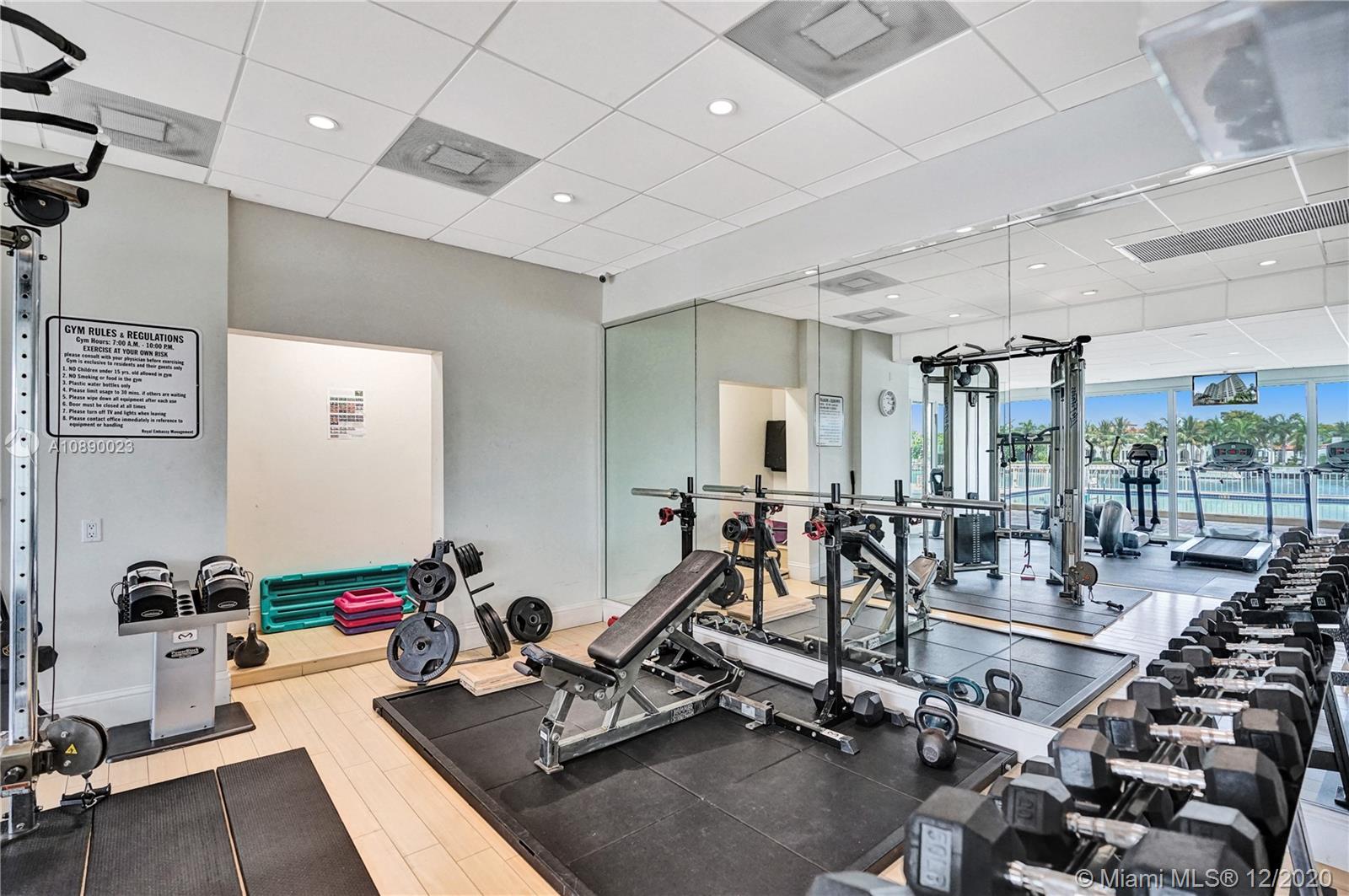 5750 Collins Avenue, Unit 15F Miami Beach, FL 33140 - Photo 64 of 65 a view of a room with gym equipment