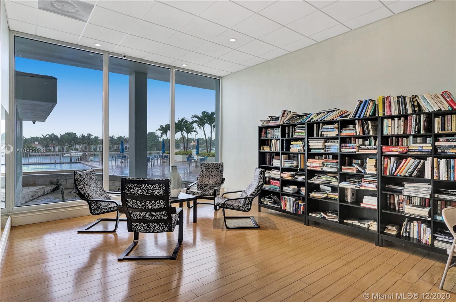 5750 Collins Avenue, Unit 15F Miami Beach, FL 33140 - Photo 65 of 65 a dining room with furniture and wooden floor
