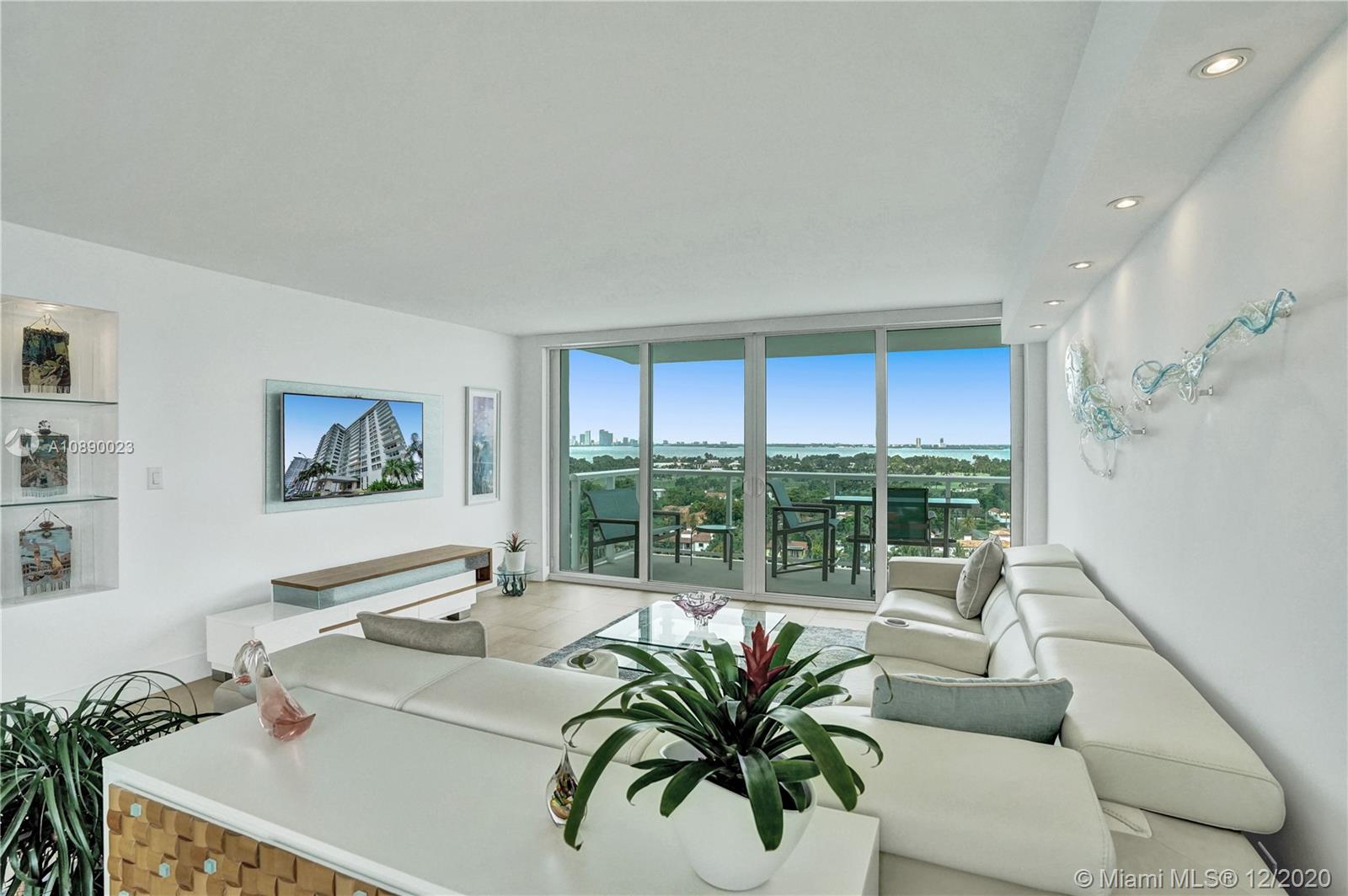 5750 Collins Avenue, Unit 15F Miami Beach, FL 33140 - Photo 8 of 65 a living room with furniture and large windows