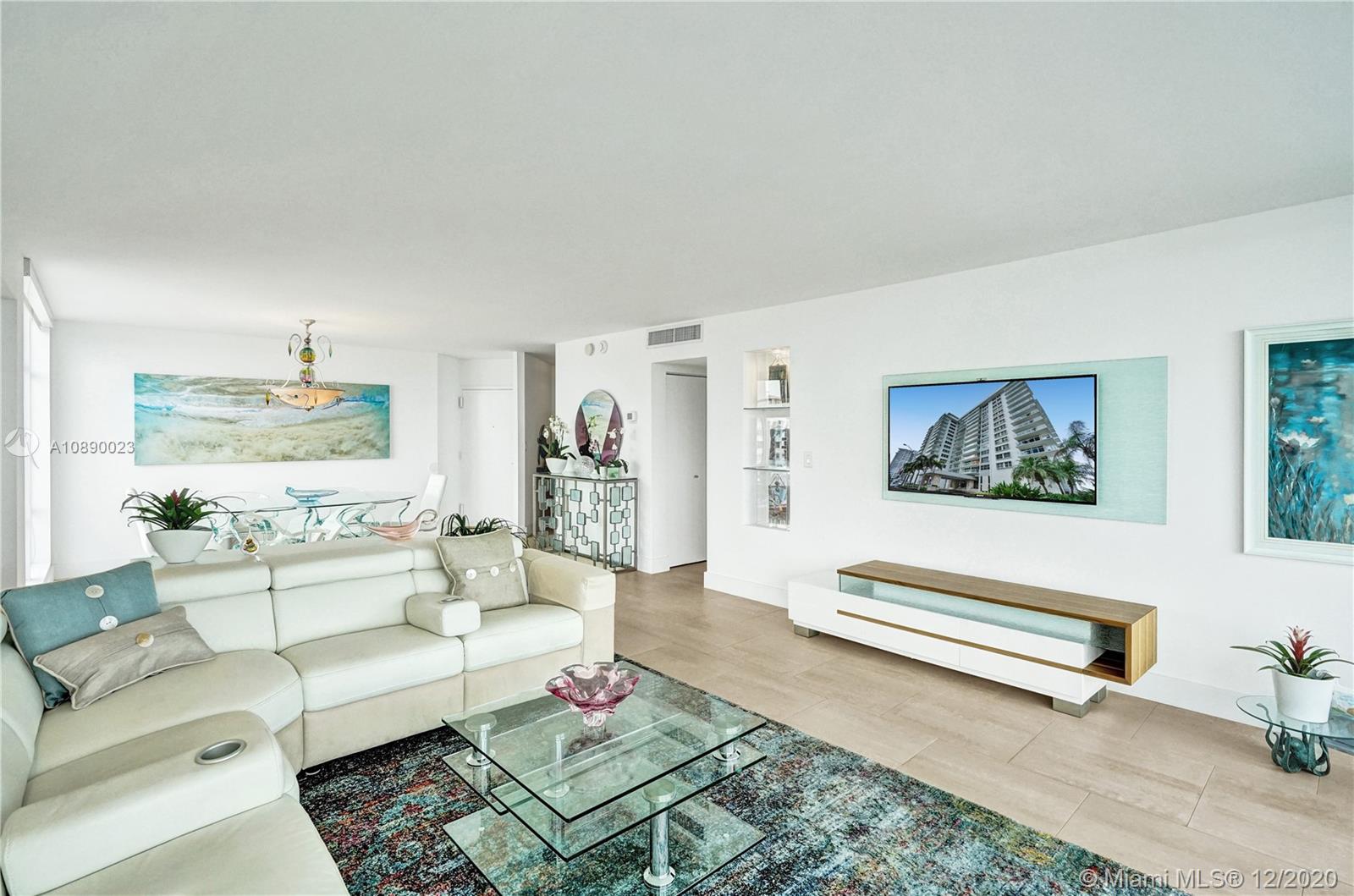 5750 Collins Avenue, Unit 15F Miami Beach, FL 33140 - Photo 9 of 65 a living room with furniture and a couch