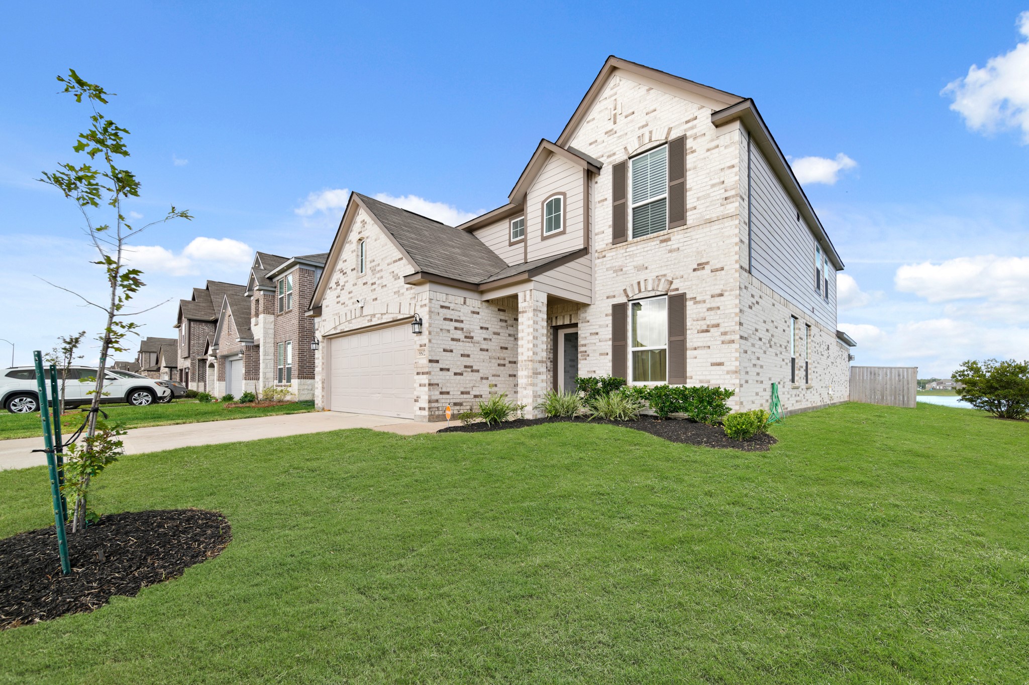 8802 Mallow Rose Way Rosharon, TX 77583 - Photo 5 of 29 This captivating home boasts a grand curbside appeal and arrival experience - highlighting a beautiful brick
and stone elevation, and a beautiful array of windows.