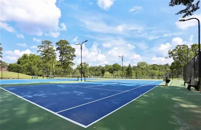 a view of an outdoor space and tennis court
