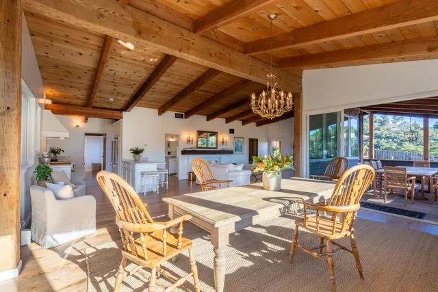 a kitchen with stainless steel appliances a stove a sink and white cabinets
