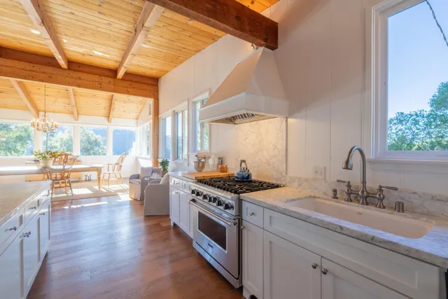 a bedroom with a large bed and a large window