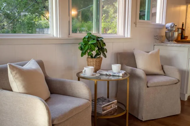 a bathroom with a granite countertop sink mirror bathtub and toilet