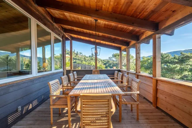 a bedroom with a large bed and a large window
