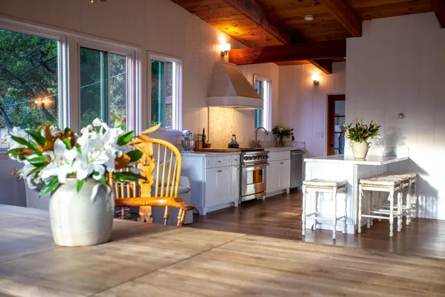 a bedroom with a bed and a table