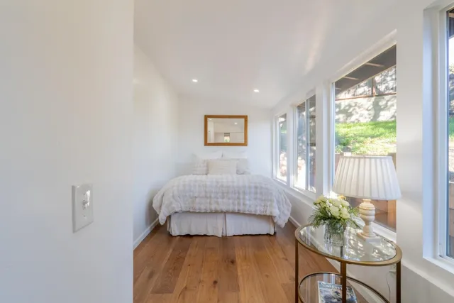 a view of a house with backyard porch and sitting area