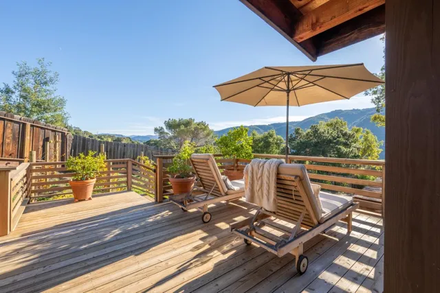 a spacious bedroom with a bed and a table in it