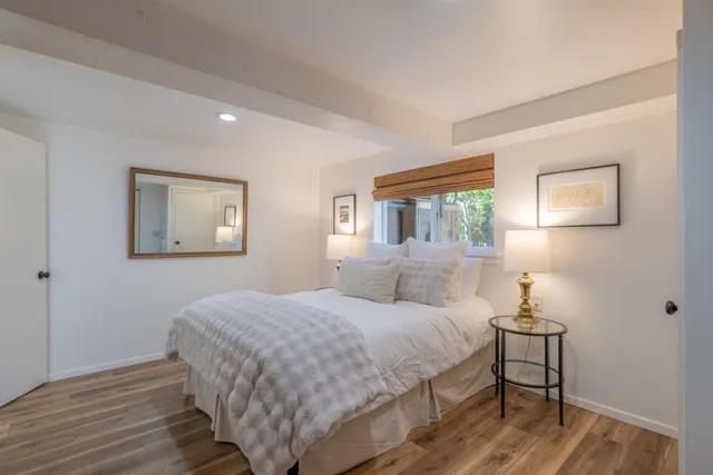 an aerial view of a house with a yard and potted plants