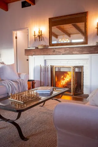a spacious bathroom with a granite countertop double vanity and a mirror