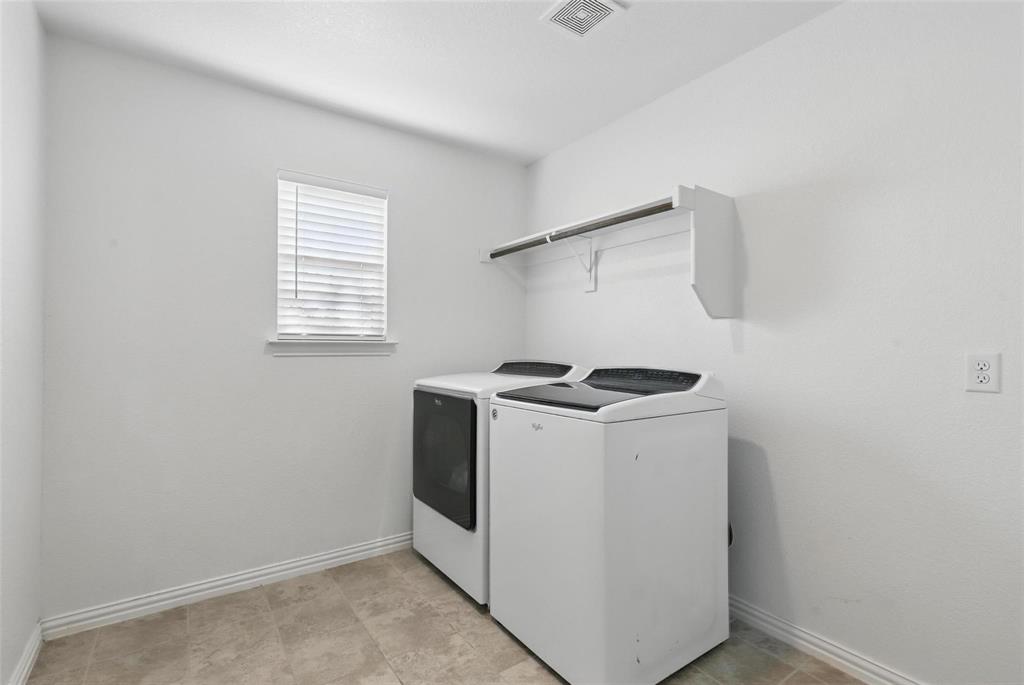 240 Springwood Ranch Loop Springtown, TX 76082 - Photo 21 of 27 a utility room with dryer and washer