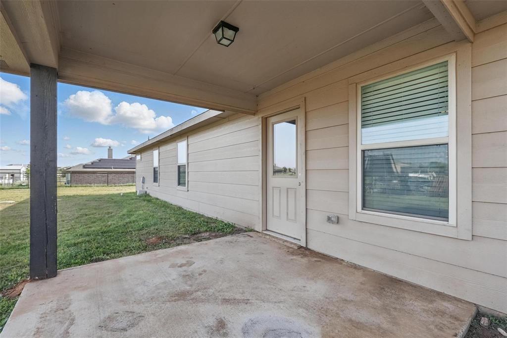 240 Springwood Ranch Loop Springtown, TX 76082 - Photo 25 of 27 a view of a backyard of the house