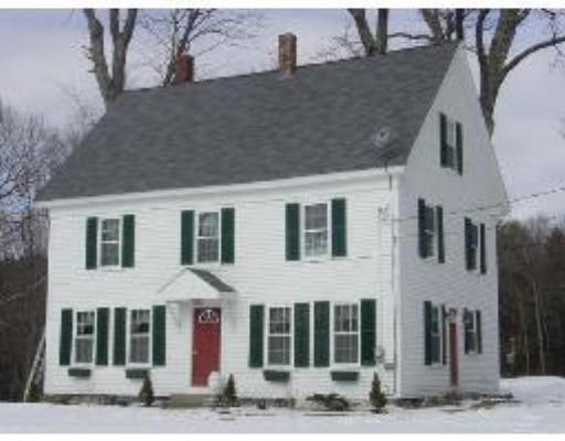 823 Orange Road Warwick, MA 01378 - Photo 1 of 8 a front view of a house with garden
