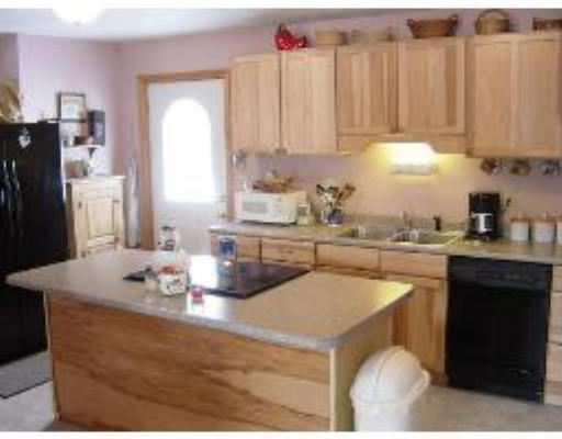 823 Orange Road Warwick, MA 01378 - Photo 3 of 8 a kitchen with a sink cabinets and window