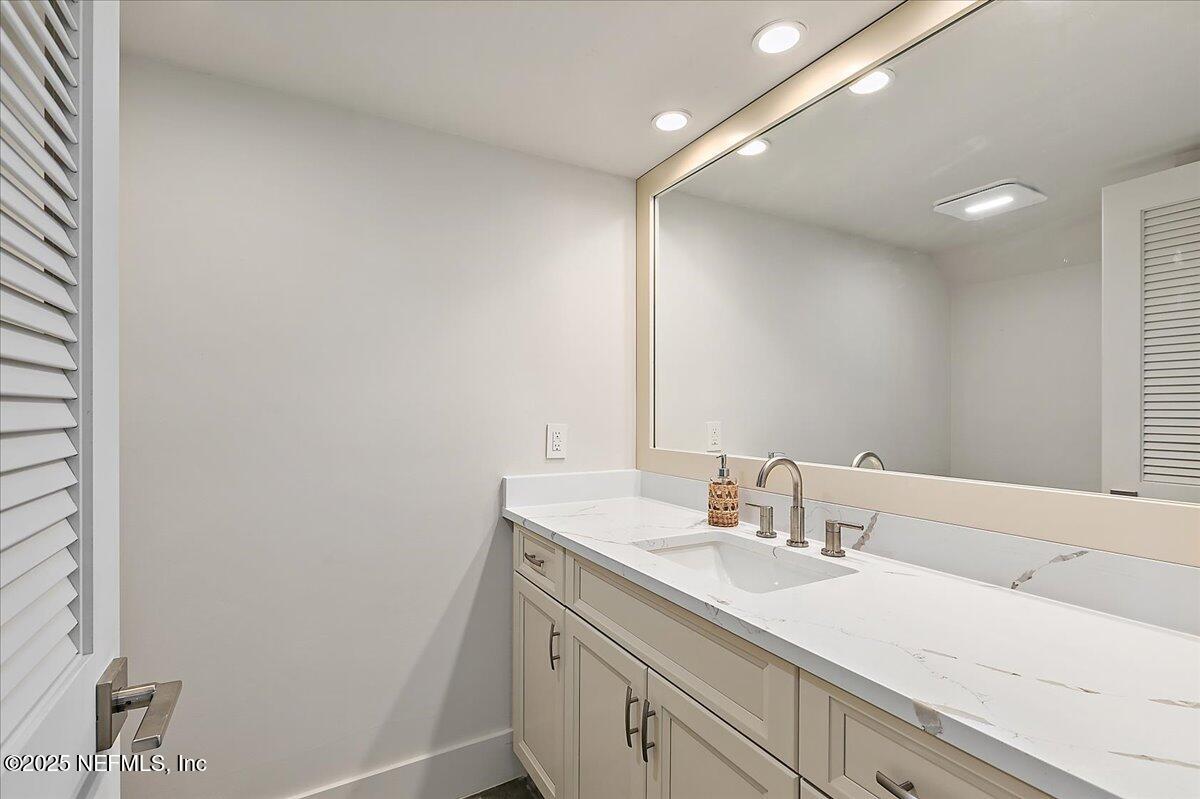 41 Fishermans Cove Road Ponte Vedra Beach, FL 32082 - Photo 16 of 36 a bathroom with a sink and a mirror