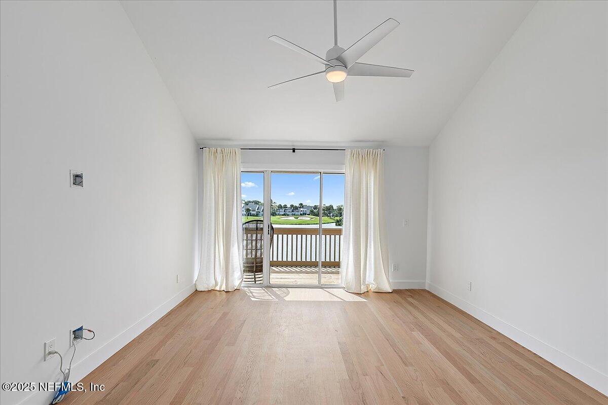 41 Fishermans Cove Road Ponte Vedra Beach, FL 32082 - Photo 22 of 36 a view of an empty room with a window and wooden floor
