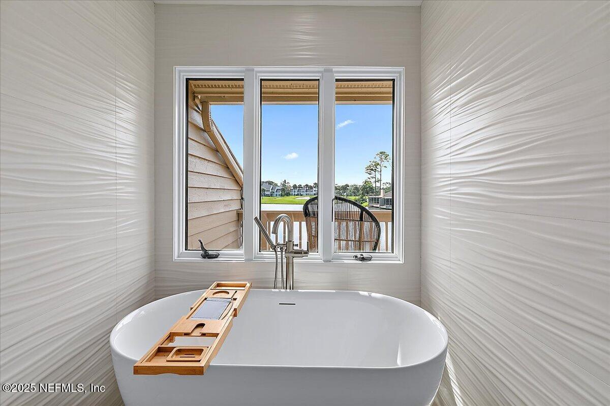 41 Fishermans Cove Road Ponte Vedra Beach, FL 32082 - Photo 28 of 36 a bathroom with a tub and a window