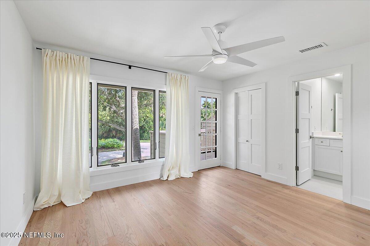 41 Fishermans Cove Road Ponte Vedra Beach, FL 32082 - Photo 30 of 36 a view of an empty room with a window and wooden floor