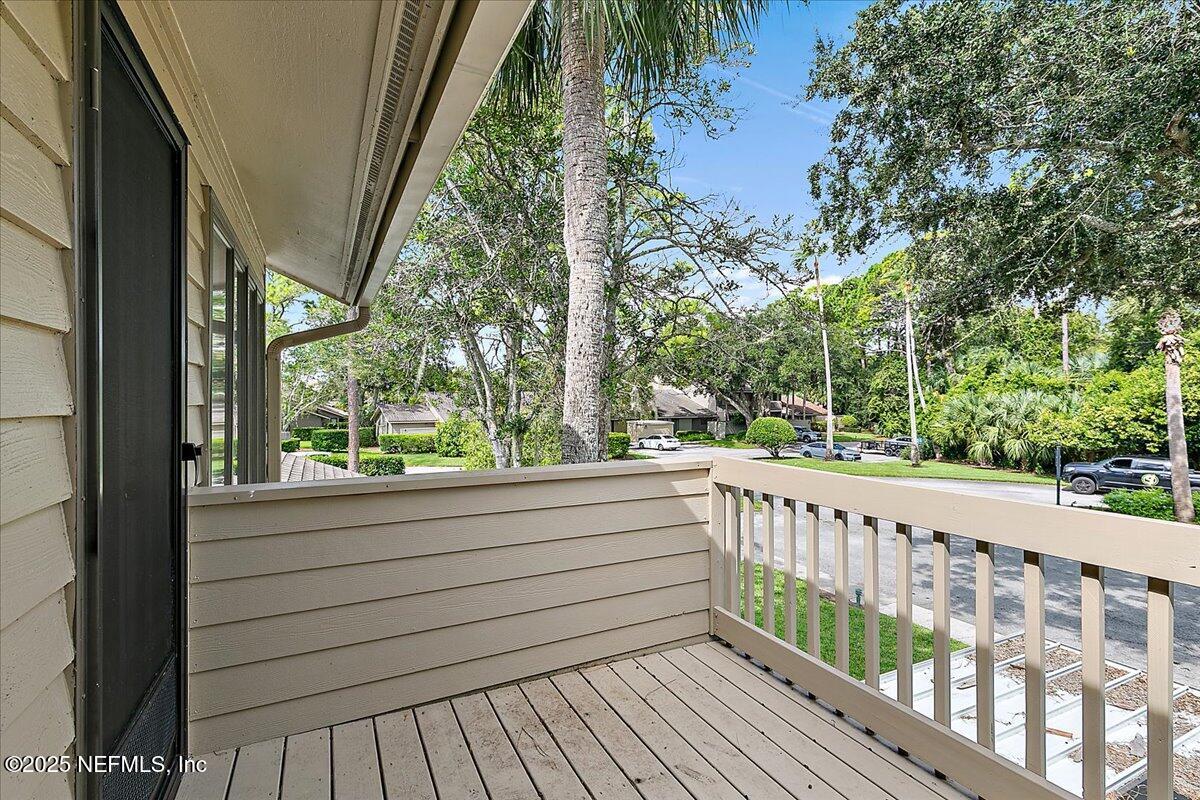 41 Fishermans Cove Road Ponte Vedra Beach, FL 32082 - Photo 31 of 36 a view of balcony with wooden floor and fence