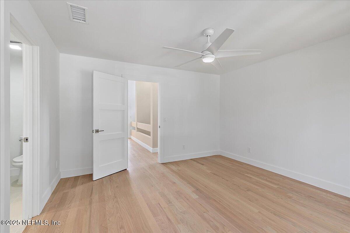 41 Fishermans Cove Road Ponte Vedra Beach, FL 32082 - Photo 32 of 36 an empty room with wooden floor fan and windows