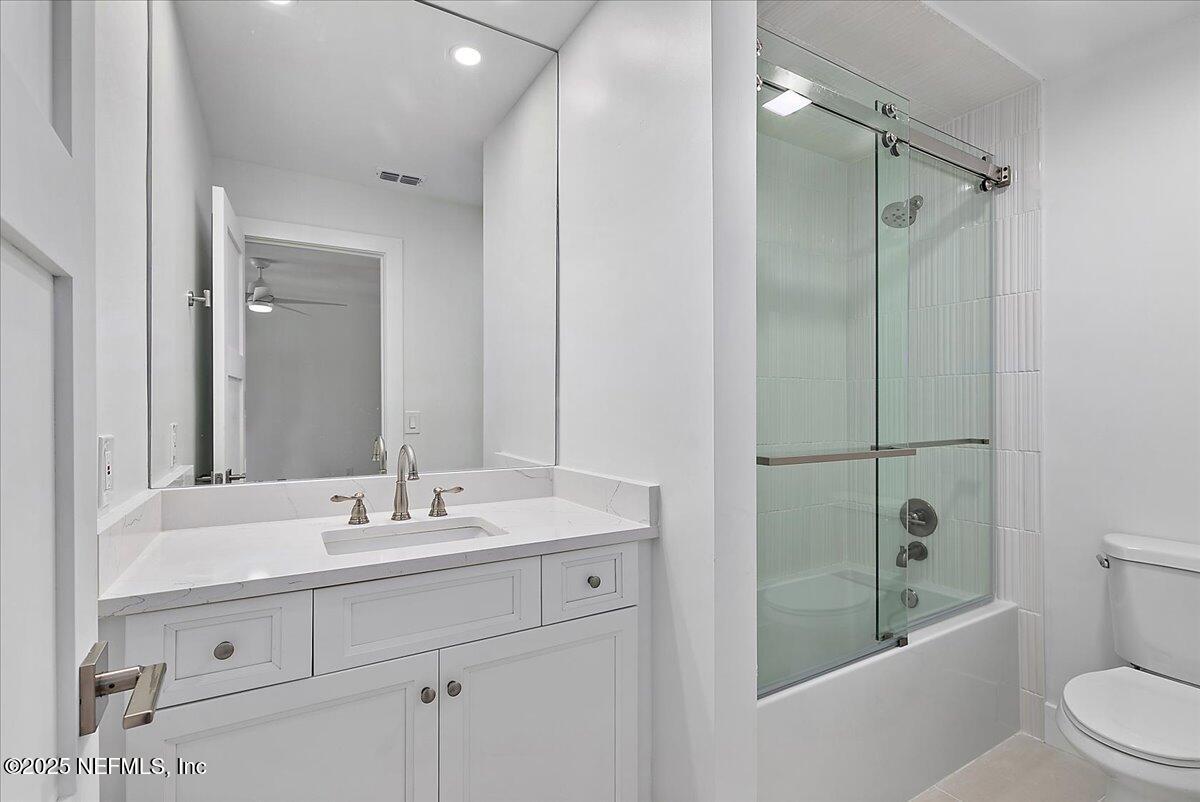 41 Fishermans Cove Road Ponte Vedra Beach, FL 32082 - Photo 33 of 36 a bathroom with a shower sink vanity mirror and toilet