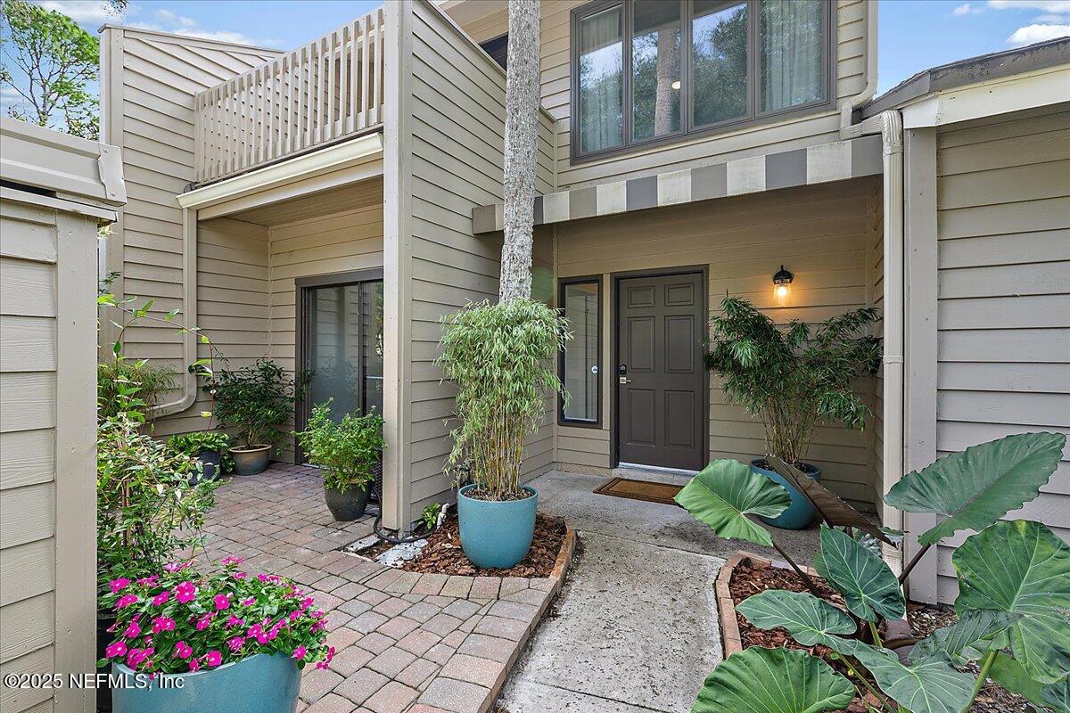 41 Fishermans Cove Road Ponte Vedra Beach, FL 32082 - Photo 4 of 36 a view of a house with potted plants