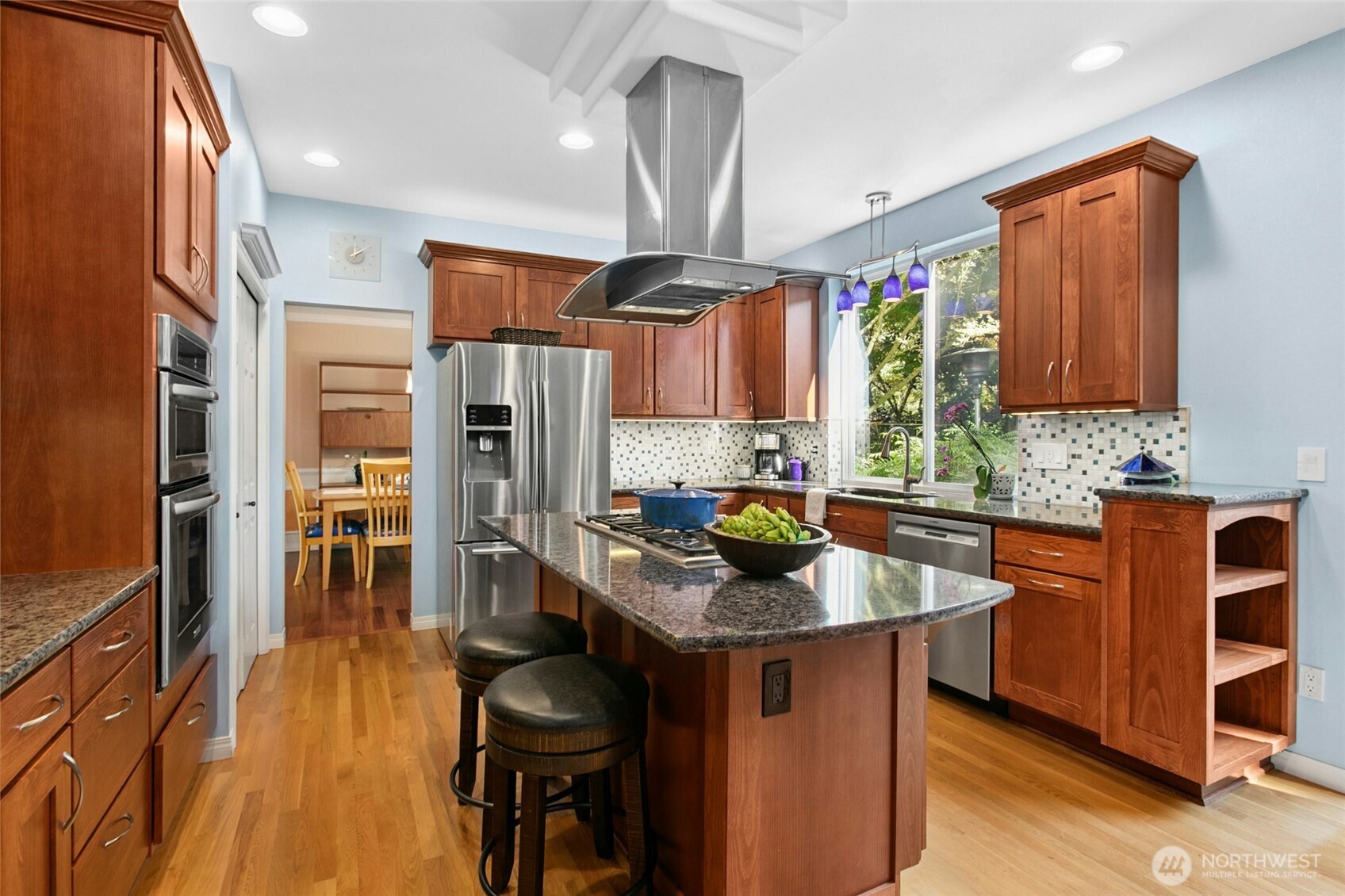 19033 29th Avenue Southeast Bothell, WA 98012 - Photo 11 of 40 a kitchen with stainless steel appliances granite countertop a stove refrigerator and a sink