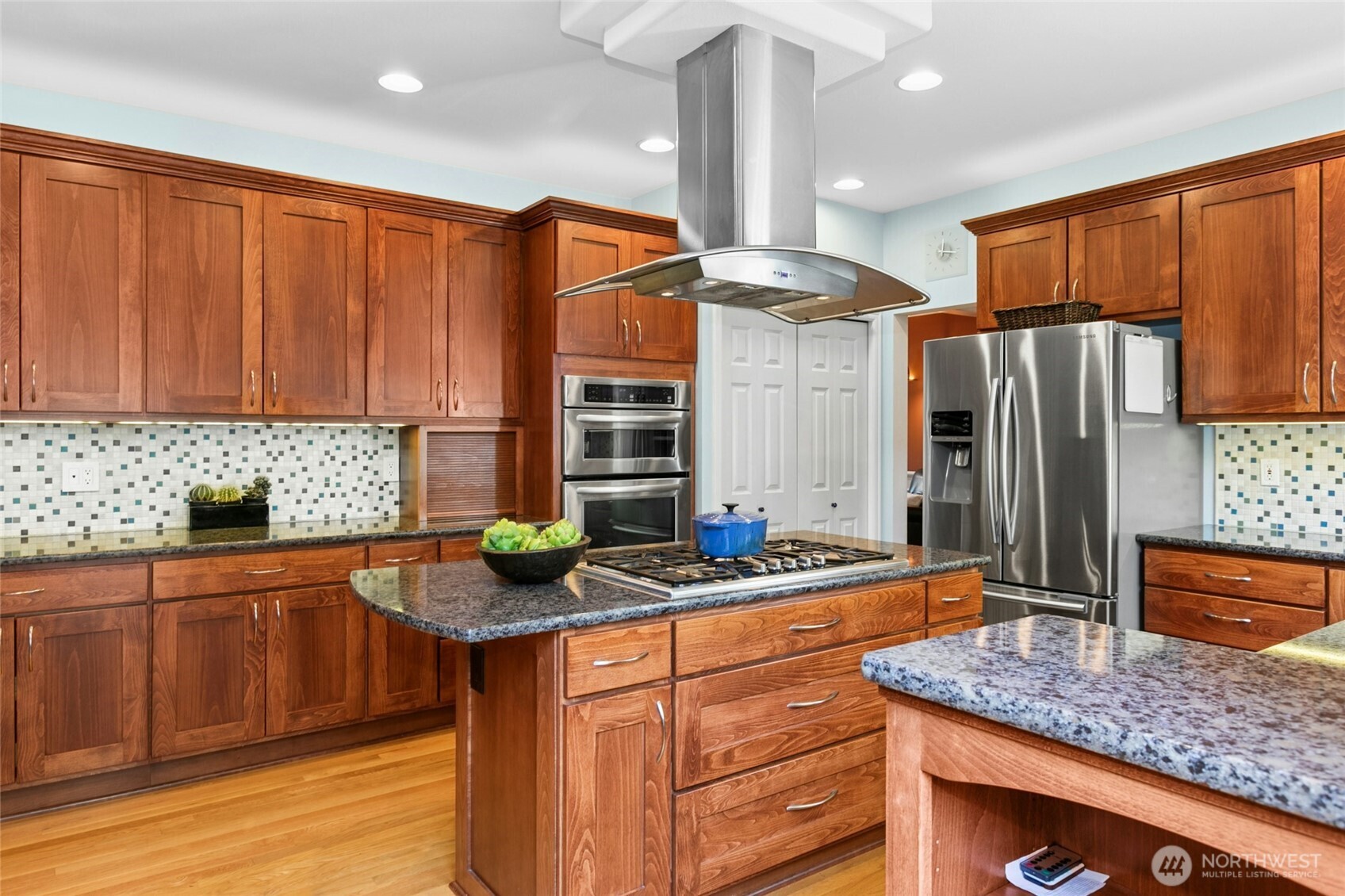 19033 29th Avenue Southeast Bothell, WA 98012 - Photo 13 of 40 a kitchen with stainless steel appliances granite countertop a sink stove and refrigerator