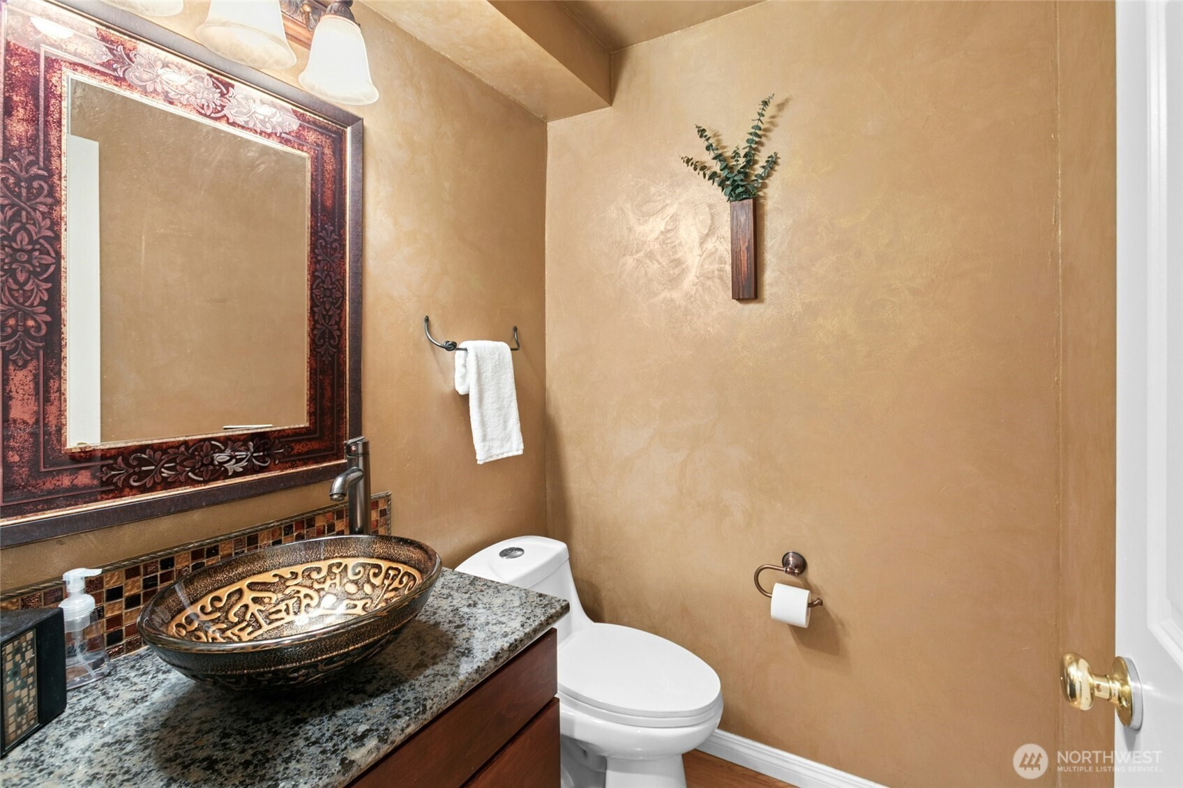 19033 29th Avenue Southeast Bothell, WA 98012 - Photo 16 of 40 a bathroom with a granite countertop toilet sink and mirror