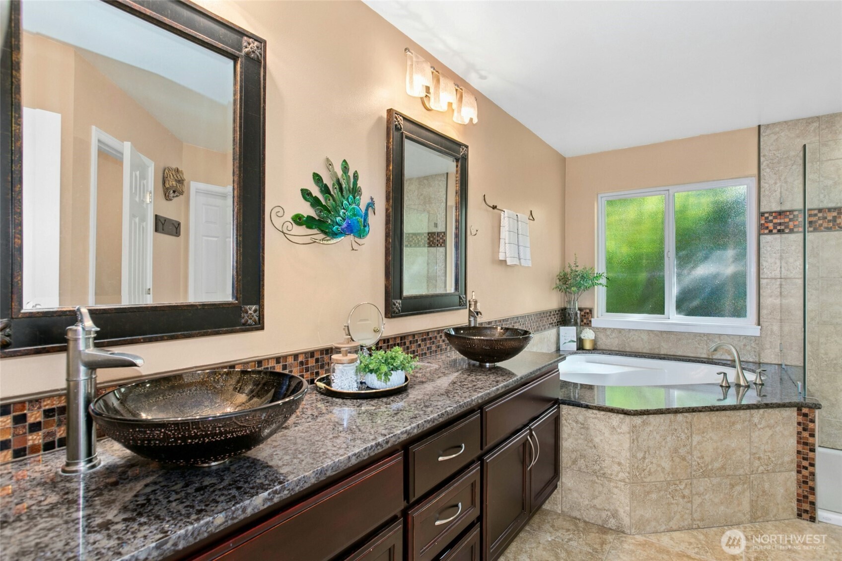 19033 29th Avenue Southeast Bothell, WA 98012 - Photo 20 of 40 a bathroom with a granite countertop sink and a large mirror