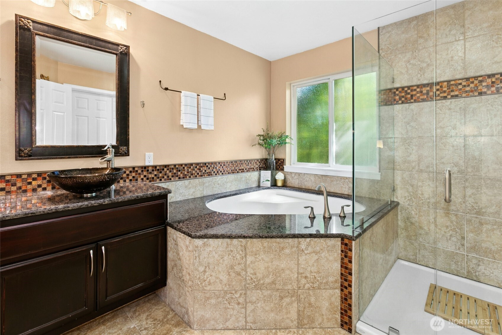 19033 29th Avenue Southeast Bothell, WA 98012 - Photo 21 of 40 a bathroom with a granite countertop sink and a mirror