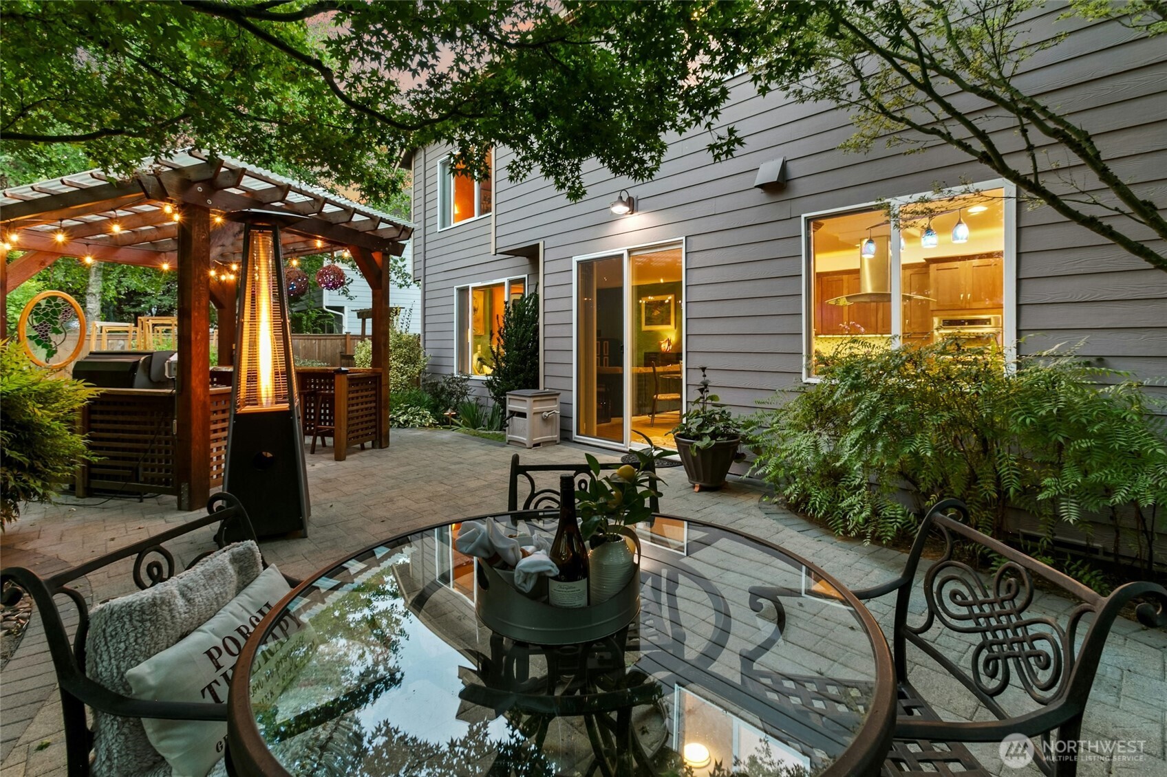 19033 29th Avenue Southeast Bothell, WA 98012 - Photo 35 of 40 a patio with tables and chairs and a umbrella