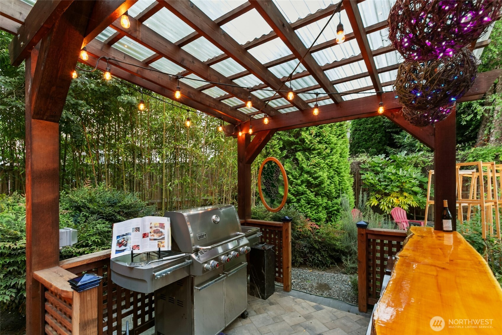 19033 29th Avenue Southeast Bothell, WA 98012 - Photo 37 of 40 a view of a patio with a table chairs and a barbeque