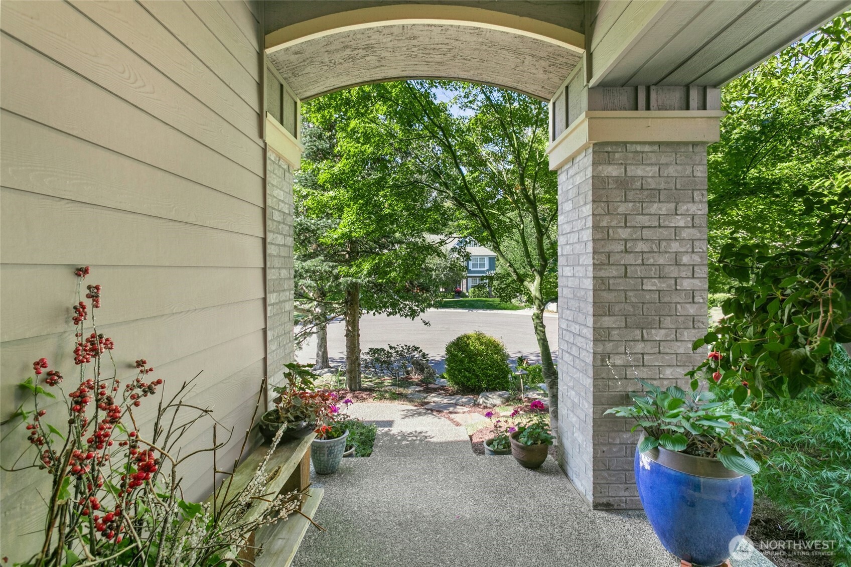 19033 29th Avenue Southeast Bothell, WA 98012 - Photo 6 of 40 a potted plant sitting in front of a house