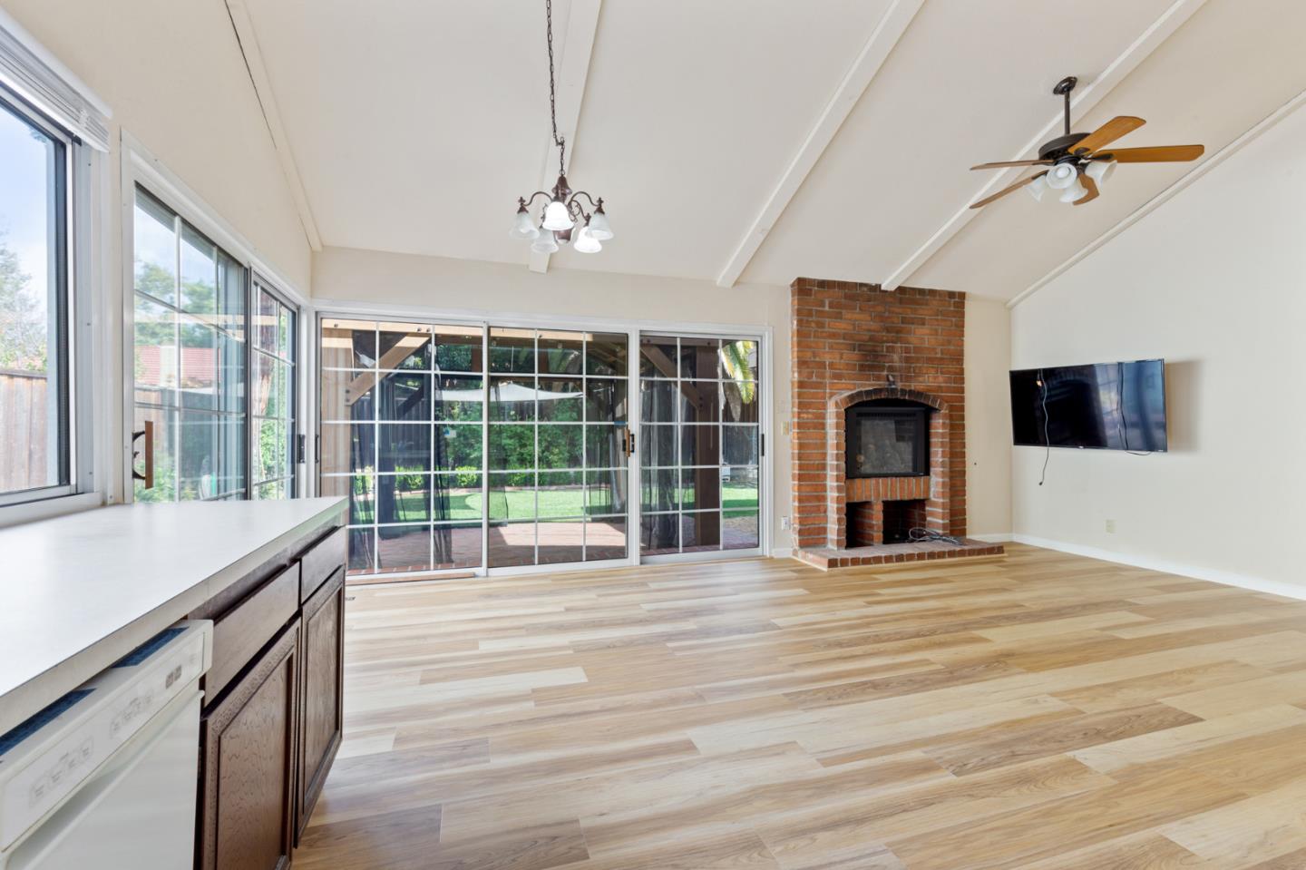 7034 Vía Pradera San Jose, CA 95139 - Photo 14 of 31 a view of an empty room with a fireplace and a window