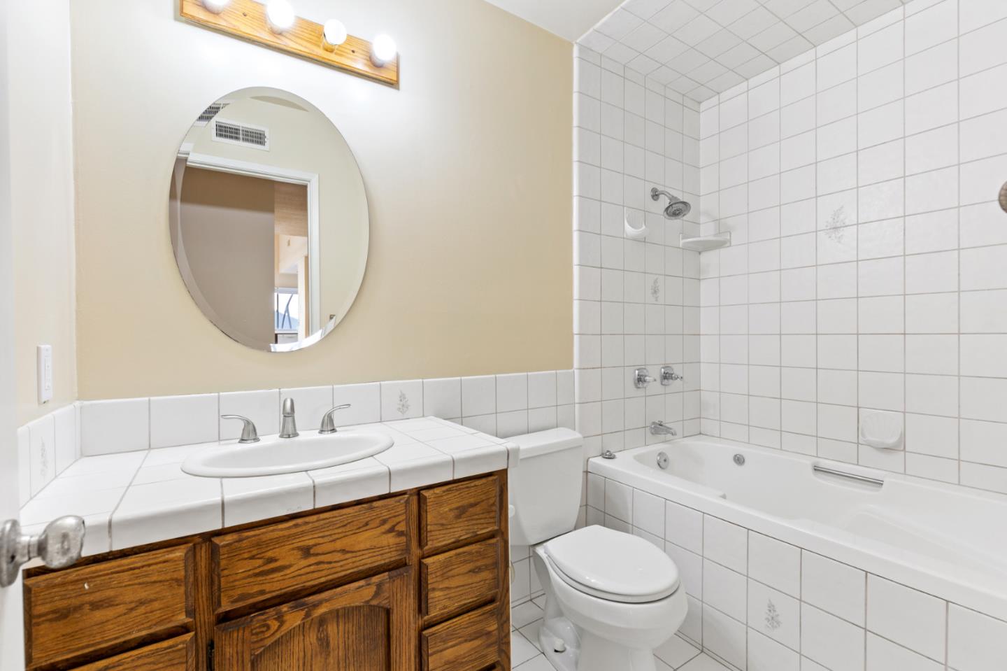 7034 Vía Pradera San Jose, CA 95139 - Photo 17 of 31 a bathroom with a sink a toilet and a mirror