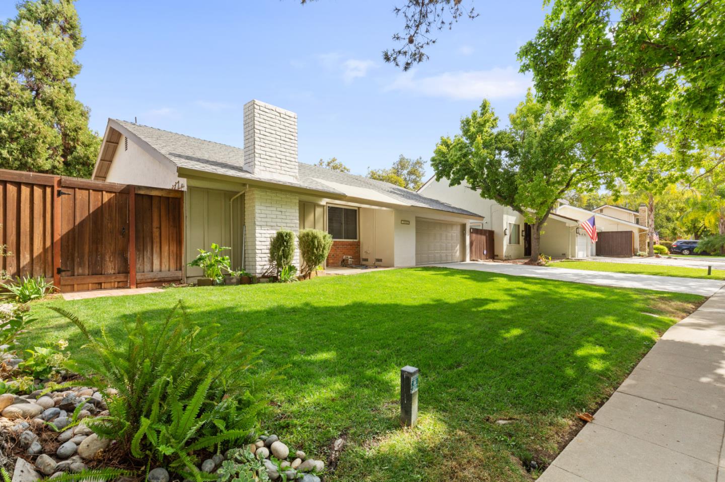 7034 Vía Pradera San Jose, CA 95139 - Photo 3 of 31 a front view of house with yard and green space