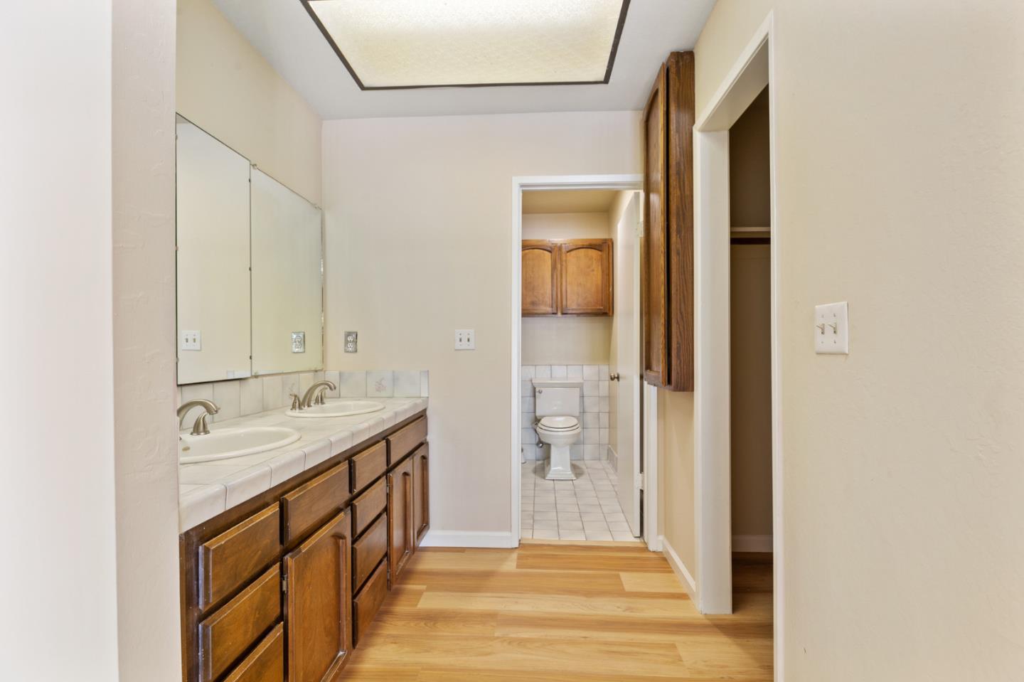 7034 Vía Pradera San Jose, CA 95139 - Photo 22 of 31 a bathroom with a sink and a mirror